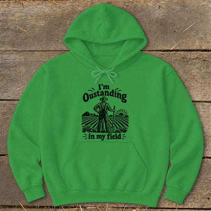 Green hoodie with "I'm Oustanding in my field" text and farmer graphic.