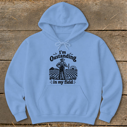 Light blue hoodie with "I'm Oustanding in my field" text and farmer graphic.