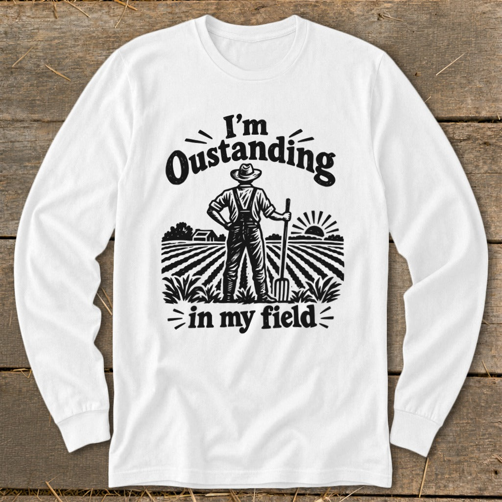 White long-sleeve shirt with "I'm Outstanding in my Field" farmer graphic.