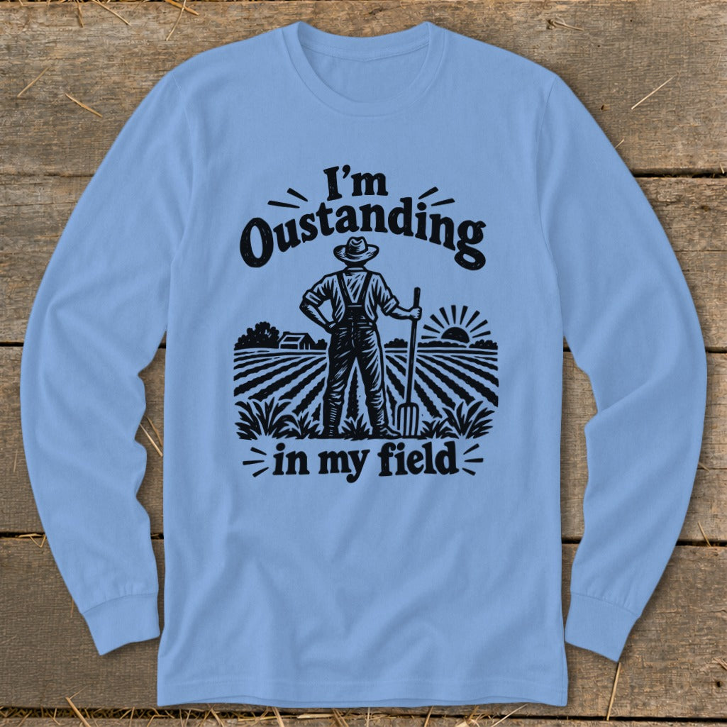 Light blue long-sleeve shirt with "I'm Oustanding in my field" text and farmer graphic.