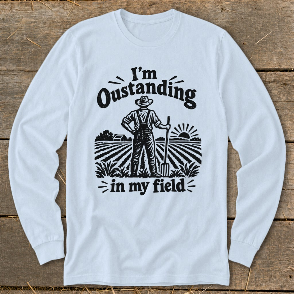 Long sleeve shirt with "I'm Outstanding in my Field" text and farmer illustration.