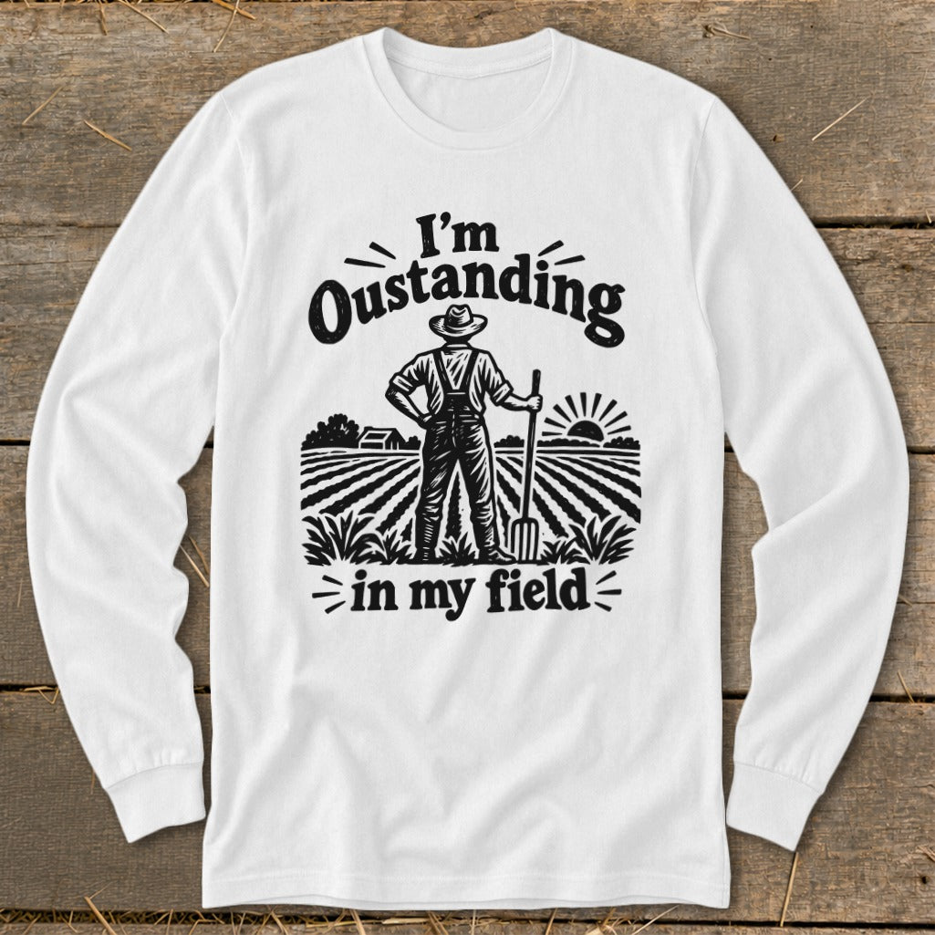 White long-sleeve shirt with graphic "I'm Oustanding in my field" and farmer.