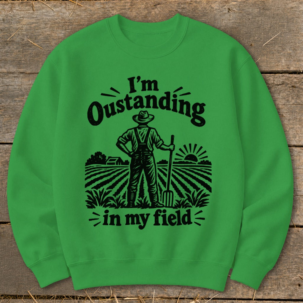 Green sweatshirt with "I'm Oustanding in my field" text and farmer graphic.