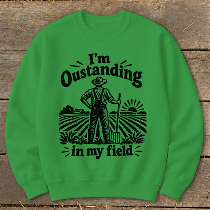 Green sweatshirt with "I'm Oustanding in my field" text and farmer graphic.