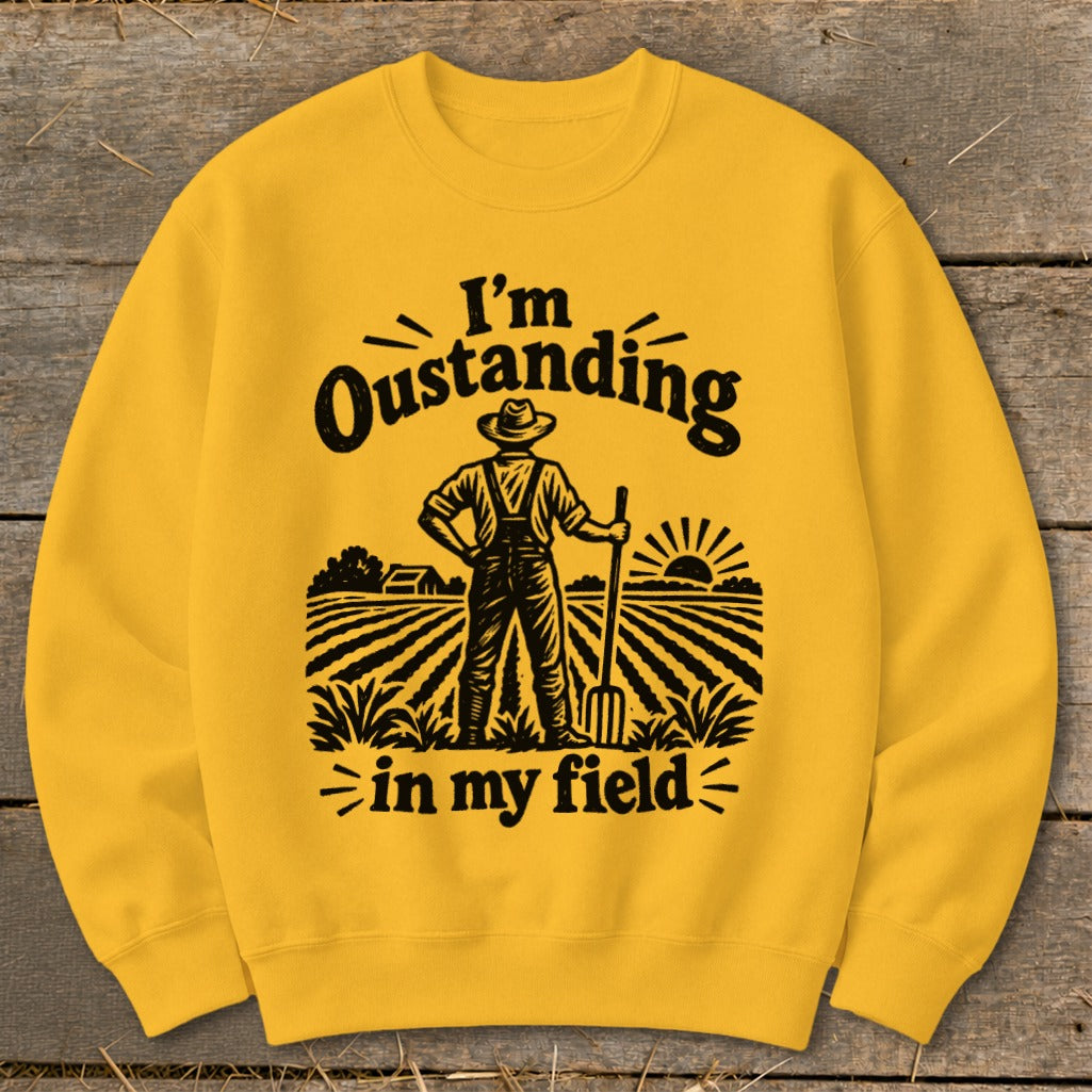 Yellow sweatshirt with "I'm Outstanding in my field" text and farmer graphic.