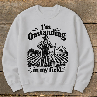 Sweatshirt with "I'm Outstanding in my Field" text and farmer graphic.