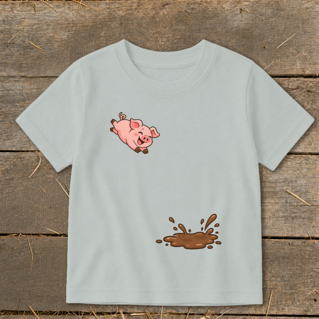 Light gray t-shirt with cartoon pig jumping near a mud puddle graphic.