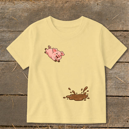 Yellow t-shirt with a cartoon pig jumping into a mud puddle design.