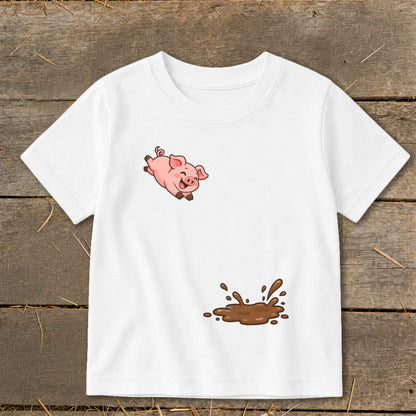 White t-shirt with cartoon pig jumping over a mud splash.