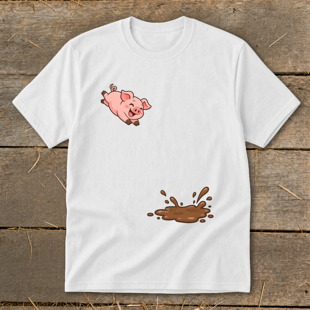 White t-shirt with a cartoon pig jumping above a muddy puddle graphic.
