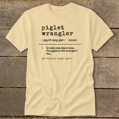 Light yellow t-shirt with "piglet wrangler" definition.