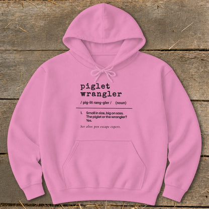 Pink hoodie with black text defining "piglet wrangler" as small in size, big on sass.