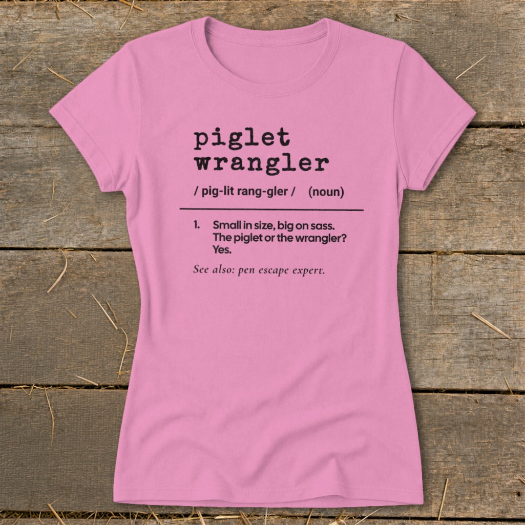 Pink t-shirt with "piglet wrangler" definition: "Small in size, big on sass."