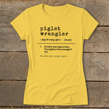 Yellow t-shirt with black text defining "piglet wrangler."