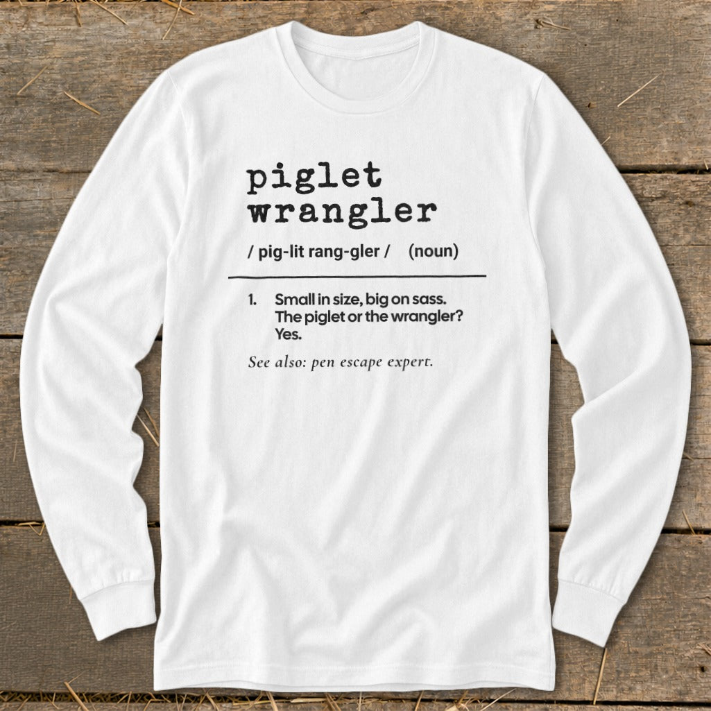 White long sleeve shirt with "piglet wrangler" definition printed on it.