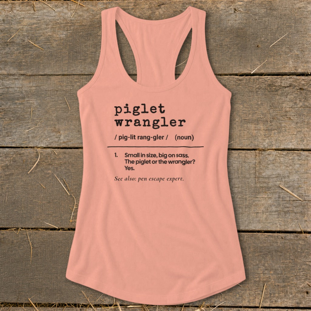 Peach tank top with "piglet wrangler" definition printed in black text.