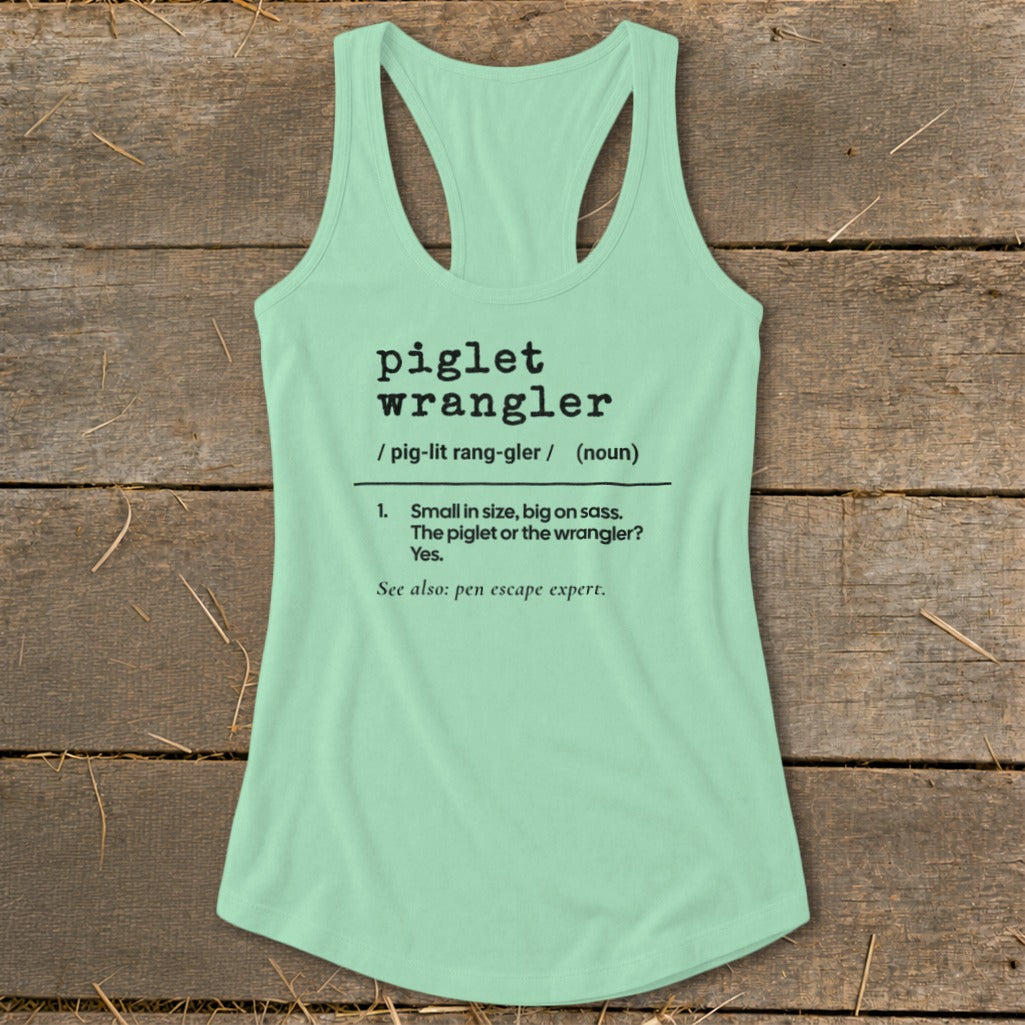 Mint green tank top with "piglet wrangler" definition printed in black text.