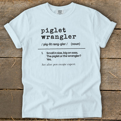 White t-shirt with "piglet wrangler" definition: "Small in size, big on sass."