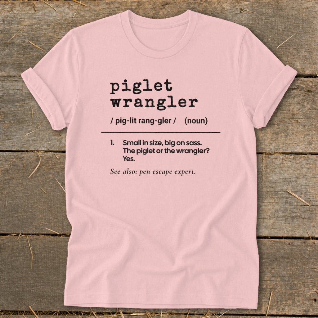 Pink t-shirt with dictionary definition for "piglet wrangler."