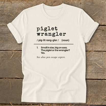 Piglet Wrangler definition t-shirt: Small in size, big on sass. Pen escape expert.