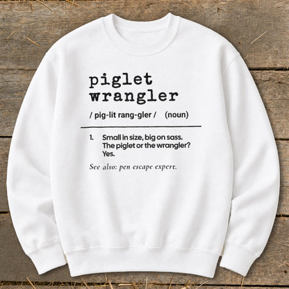 White sweatshirt with black text defining "piglet wrangler."
