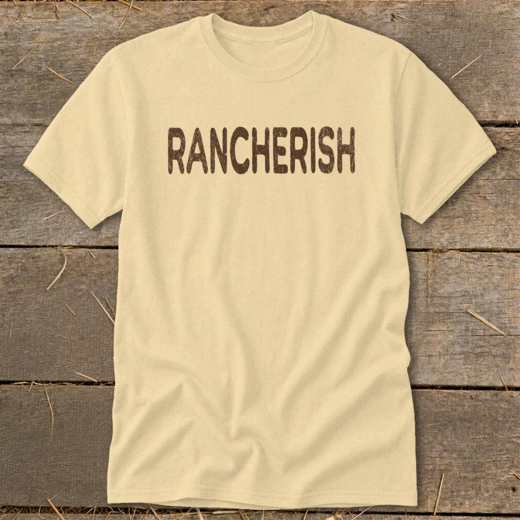 Pale yellow t-shirt with brown distressed text reading "RANCHERISH".