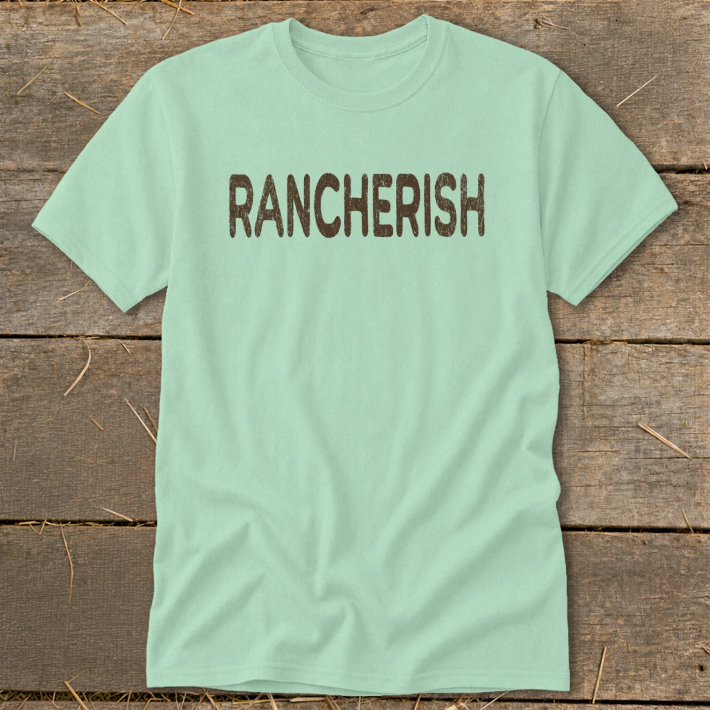 Light green t-shirt with distressed brown "RANCHERISH" text across chest.