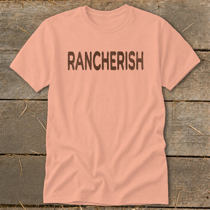 Peach t-shirt with "RANCHERISH" printed in distressed brown letters.