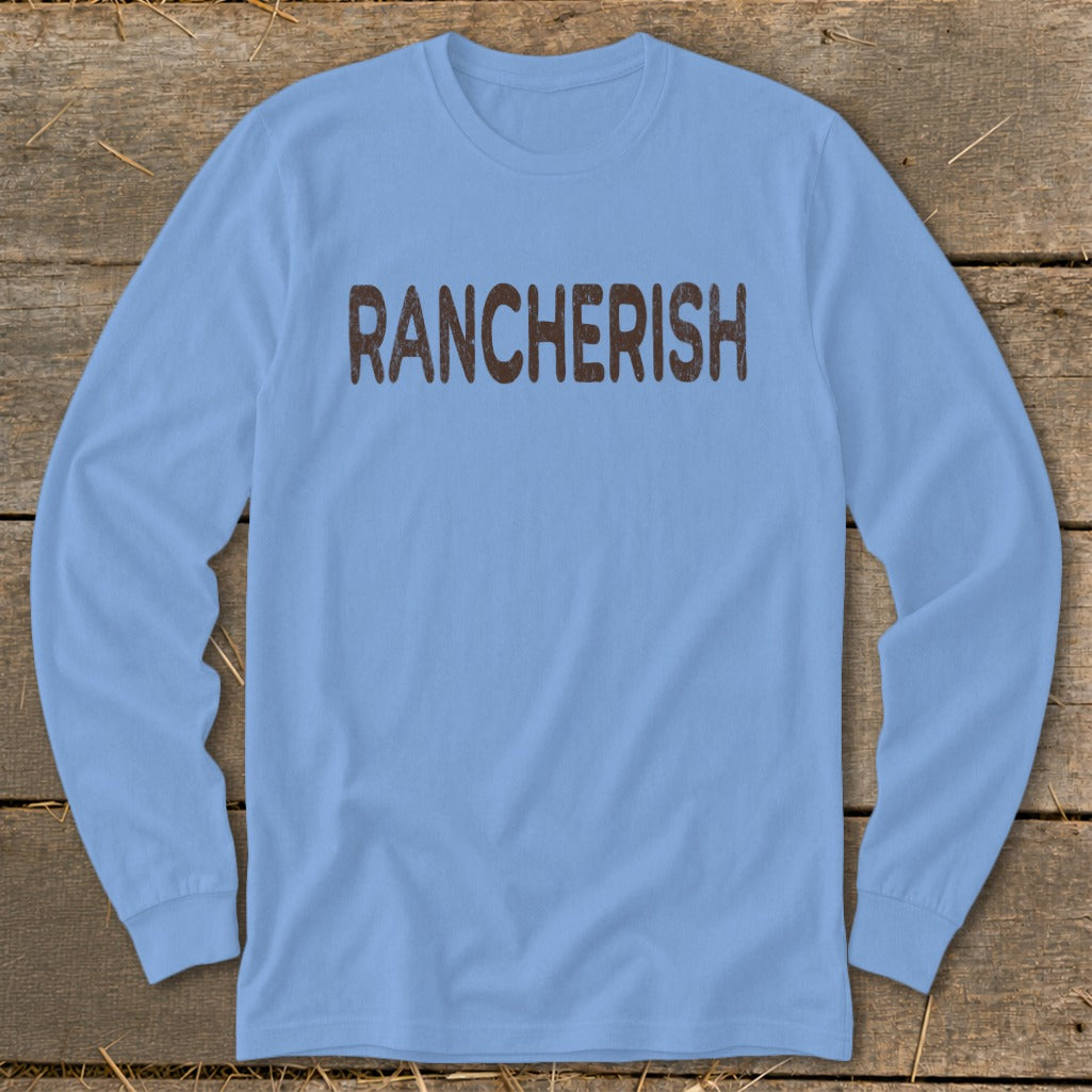 Light blue long sleeve shirt with "RANCHERISH" printed in brown.
