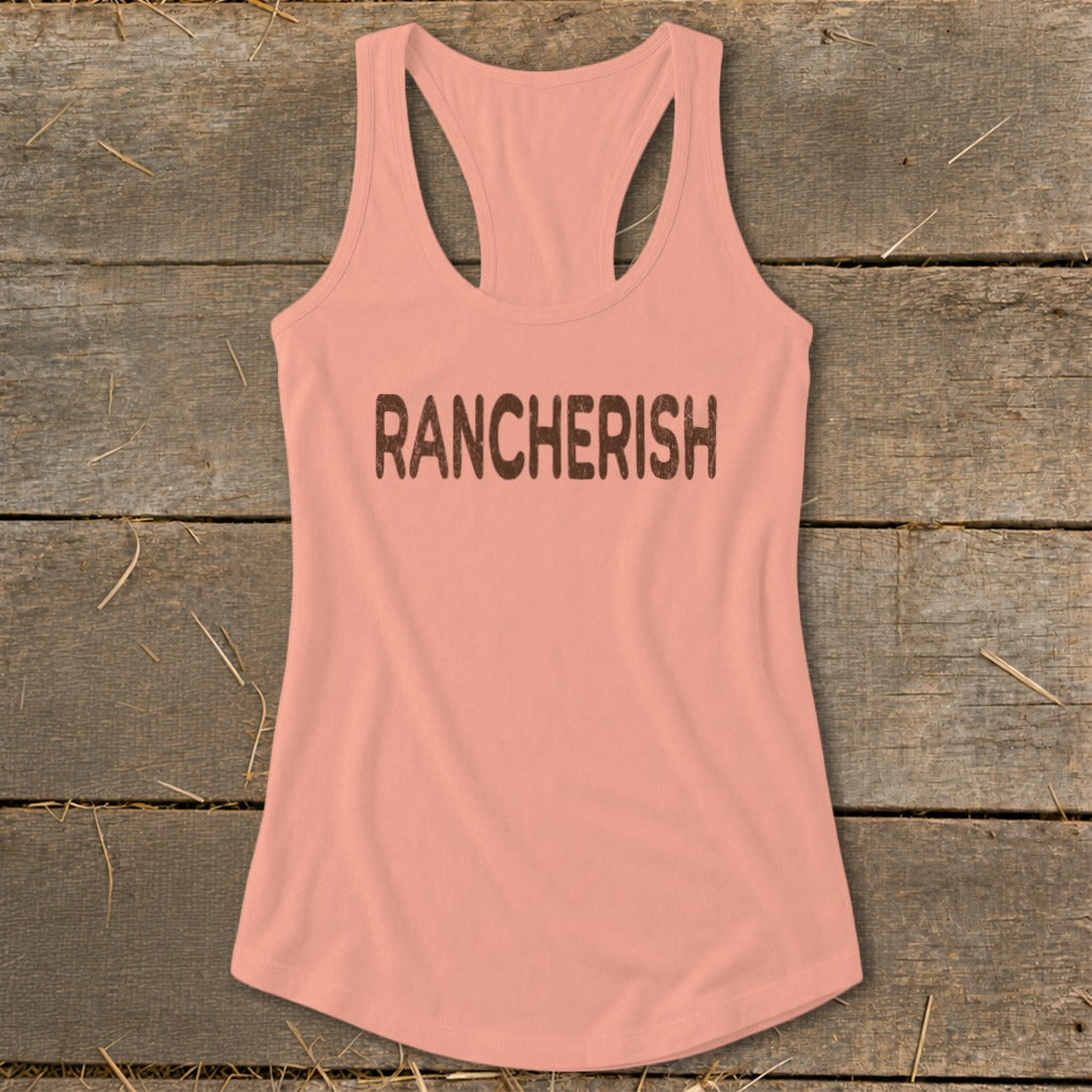 Peach racerback tank top with "RANCHERISH" printed in distressed brown letters.
