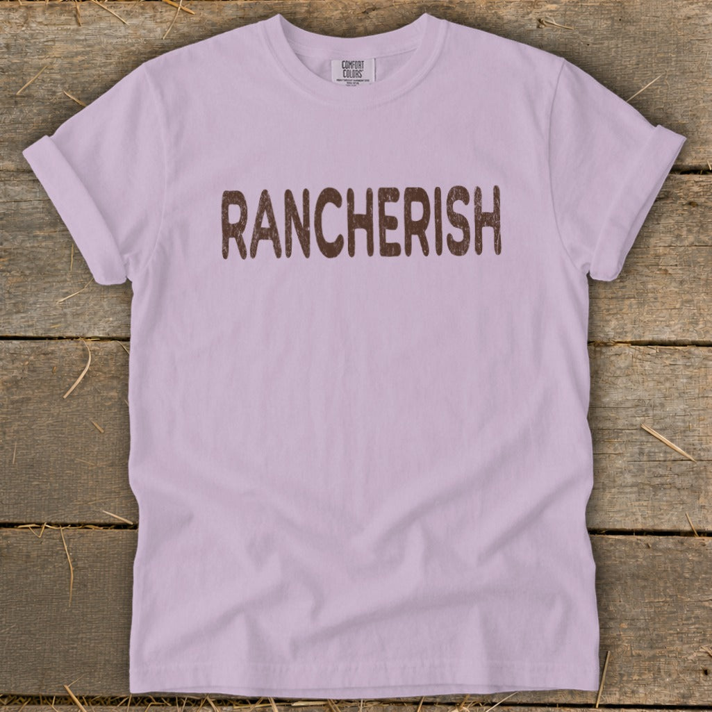 Lilac t-shirt with brown text that reads "RANCHERISH".