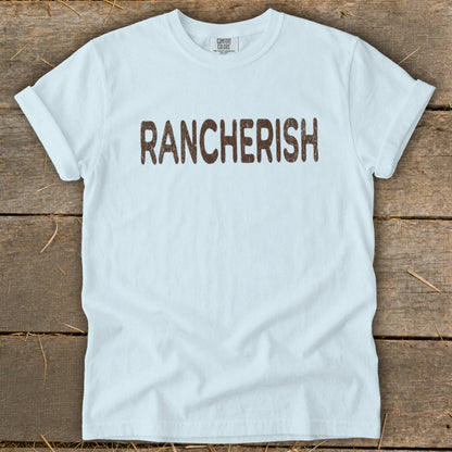 Light blue t-shirt with brown text reading "RANCHERISH"
