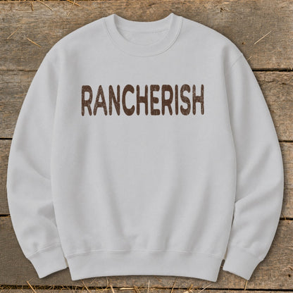 Light grey crewneck sweatshirt with "RANCHERISH" printed in brown textured font.