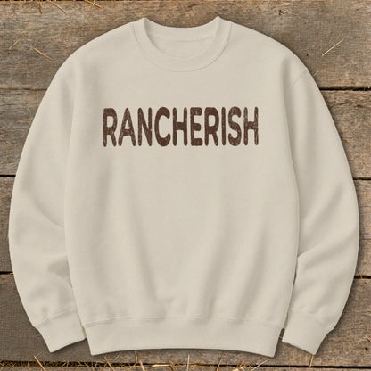 Cream sweatshirt with "RANCHERISH" text in distressed brown letters.