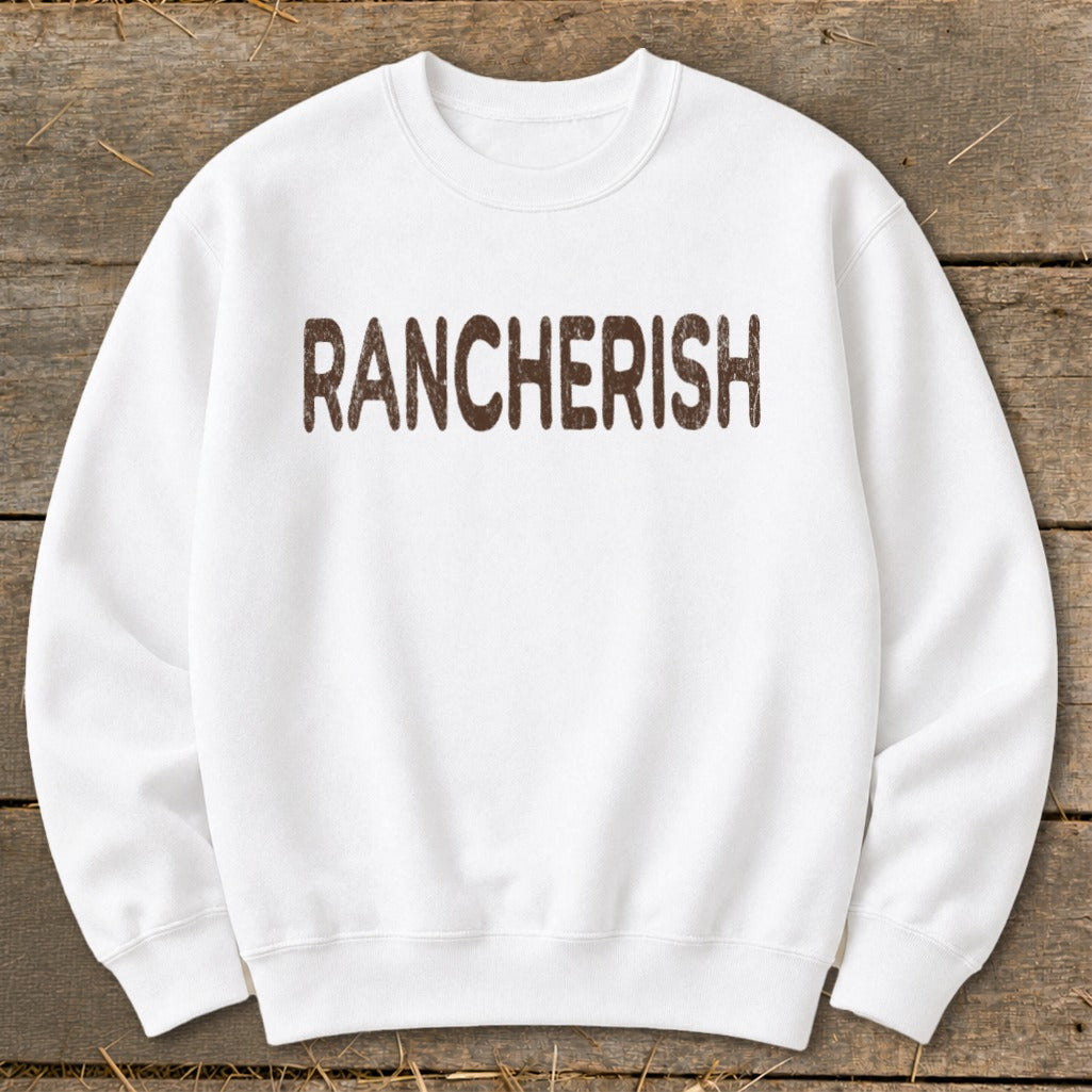 White crewneck sweatshirt with brown "RANCHERISH" text.