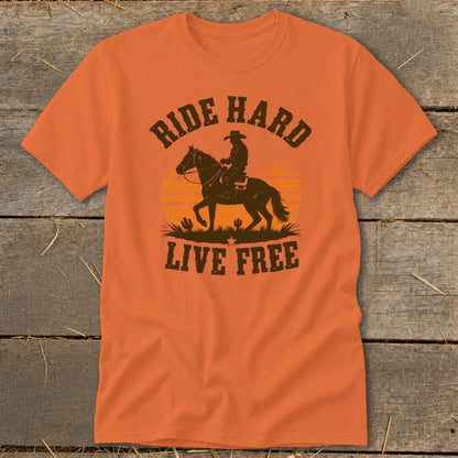 Orange t-shirt with cowboy on horse graphic and text "Ride Hard Live Free".