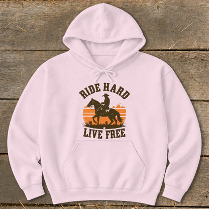 Pink hoodie with silhouette of cowboy on horseback and "Ride Hard Live Free" text.