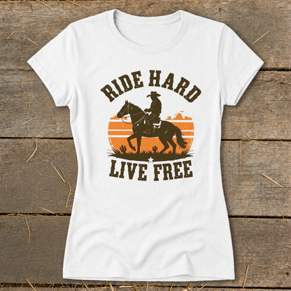 White t-shirt with "Ride Hard Live Free" text and cowboy on horseback graphic.