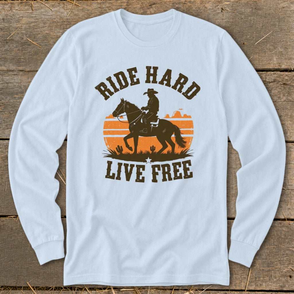 Long sleeve shirt with graphic of cowboy on horse, sunset, and text "RIDE HARD LIVE FREE".