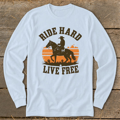 Long sleeve shirt with graphic of cowboy on horse, sunset, and text "RIDE HARD LIVE FREE".
