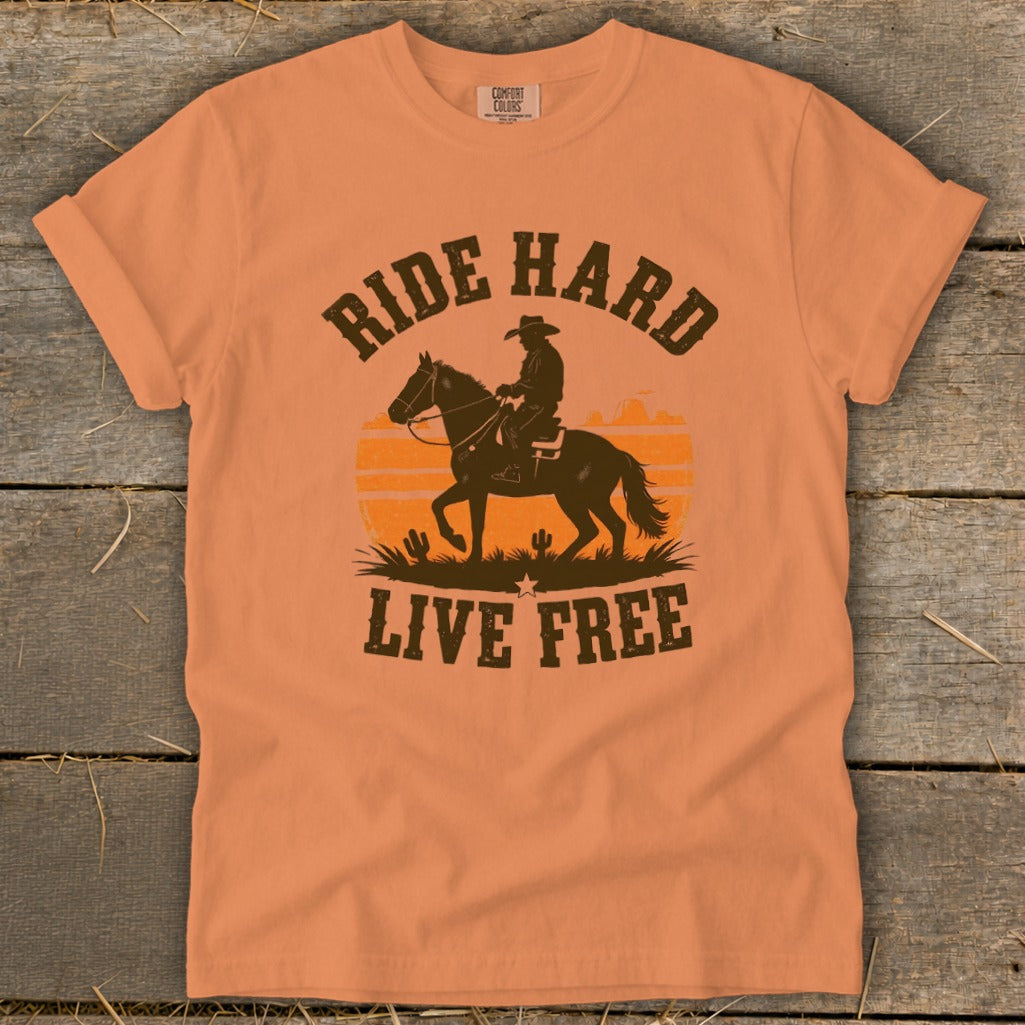 Orange t-shirt with cowboy silhouette riding horse and text "RIDE HARD LIVE FREE".