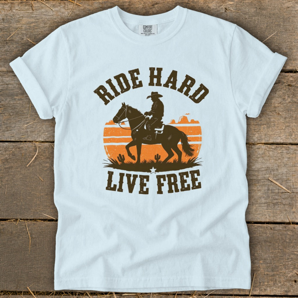 T-shirt with cowboy on horse silhouette, sunset, and text "RIDE HARD LIVE FREE".