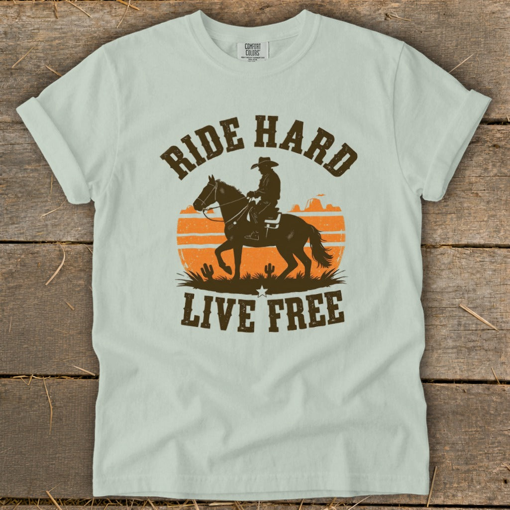 Light green t-shirt with text "RIDE HARD LIVE FREE" and cowboy on horseback graphic.