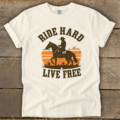 White t-shirt with distressed cowboy riding horse graphic and text "RIDE HARD LIVE FREE".