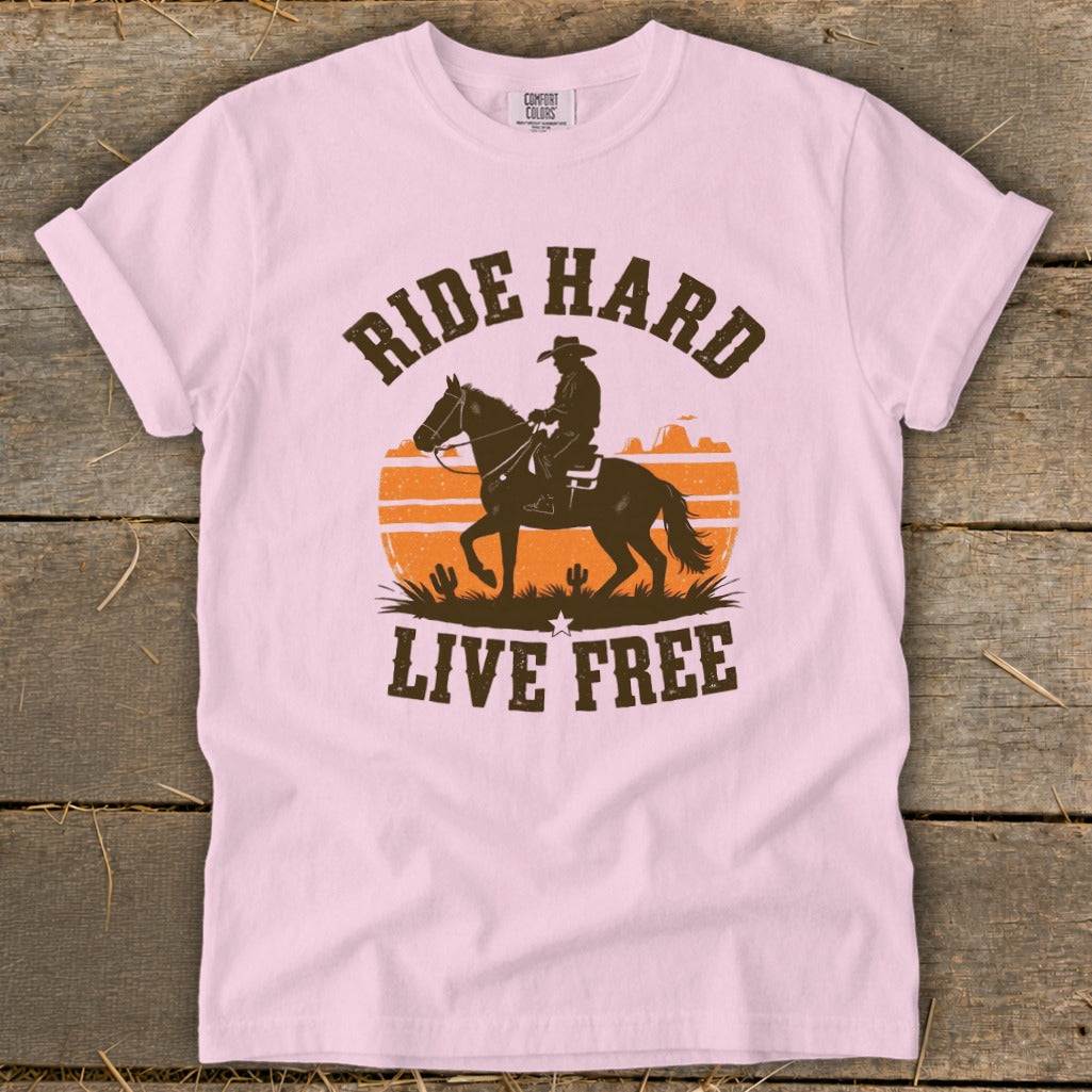 Pink t-shirt with "RIDE HARD LIVE FREE" text and cowboy on horseback silhouette.
