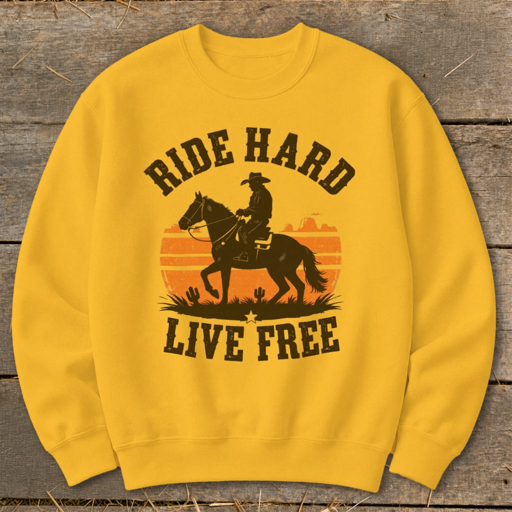 Yellow sweatshirt with cowboy on horse, sunset, and "Ride Hard Live Free" text.
