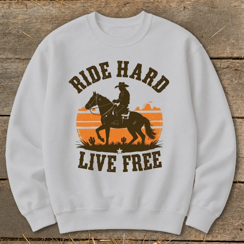 White sweatshirt with a cowboy silhouette on a horse and "Ride Hard Live Free" text.