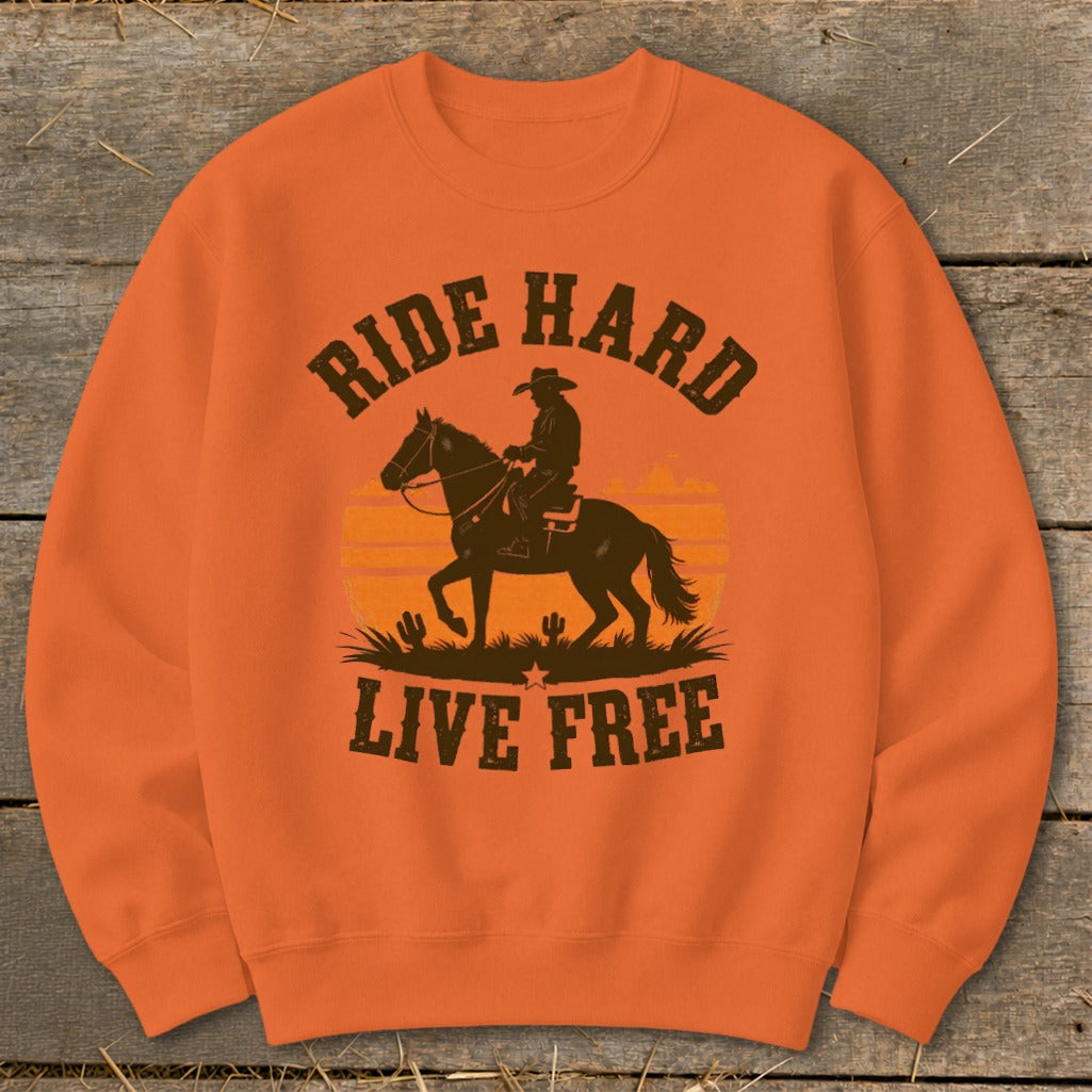 Orange sweatshirt with graphic of cowboy riding horse, text "RIDE HARD LIVE FREE".