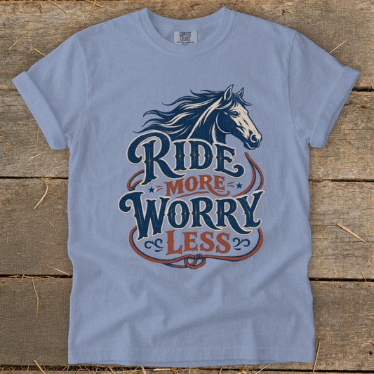 Blue t-shirt with horse graphic and "Ride More Worry Less" text.