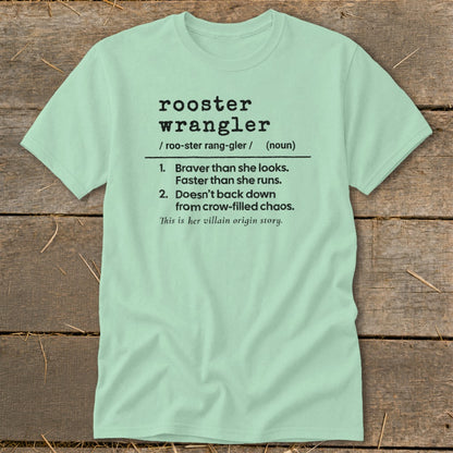 Light green t-shirt with text defining "rooster wrangler" as brave and fast.